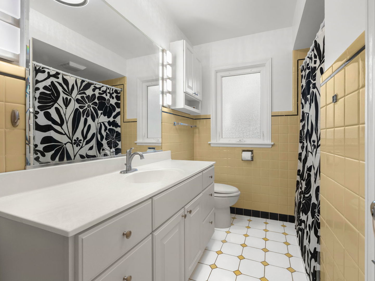 6872 North Loron Avenue Chicago, IL 60646 - Photo 12 of 25 a bathroom with a sink toilet and shower