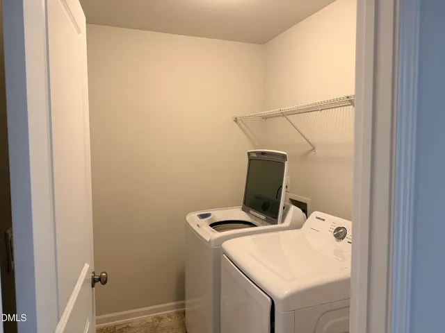 a white bath tub sitting next to a window