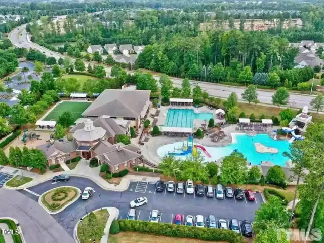 an aerial view of a house with garden space and street view