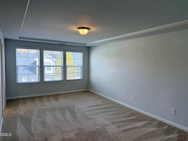 a view of staircase with wooden floor and white walls