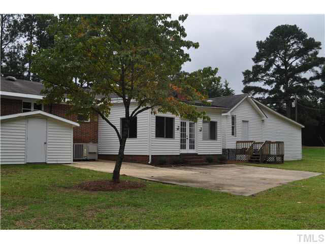 4579 Barber Mill Road Clayton, NC 27520 - Photo 24 of 24 Large backyard, with storage shed, patio, and deck