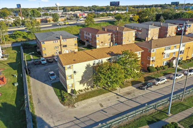 an aerial view of a houses with yard