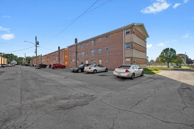 a view of car parked on road with building
