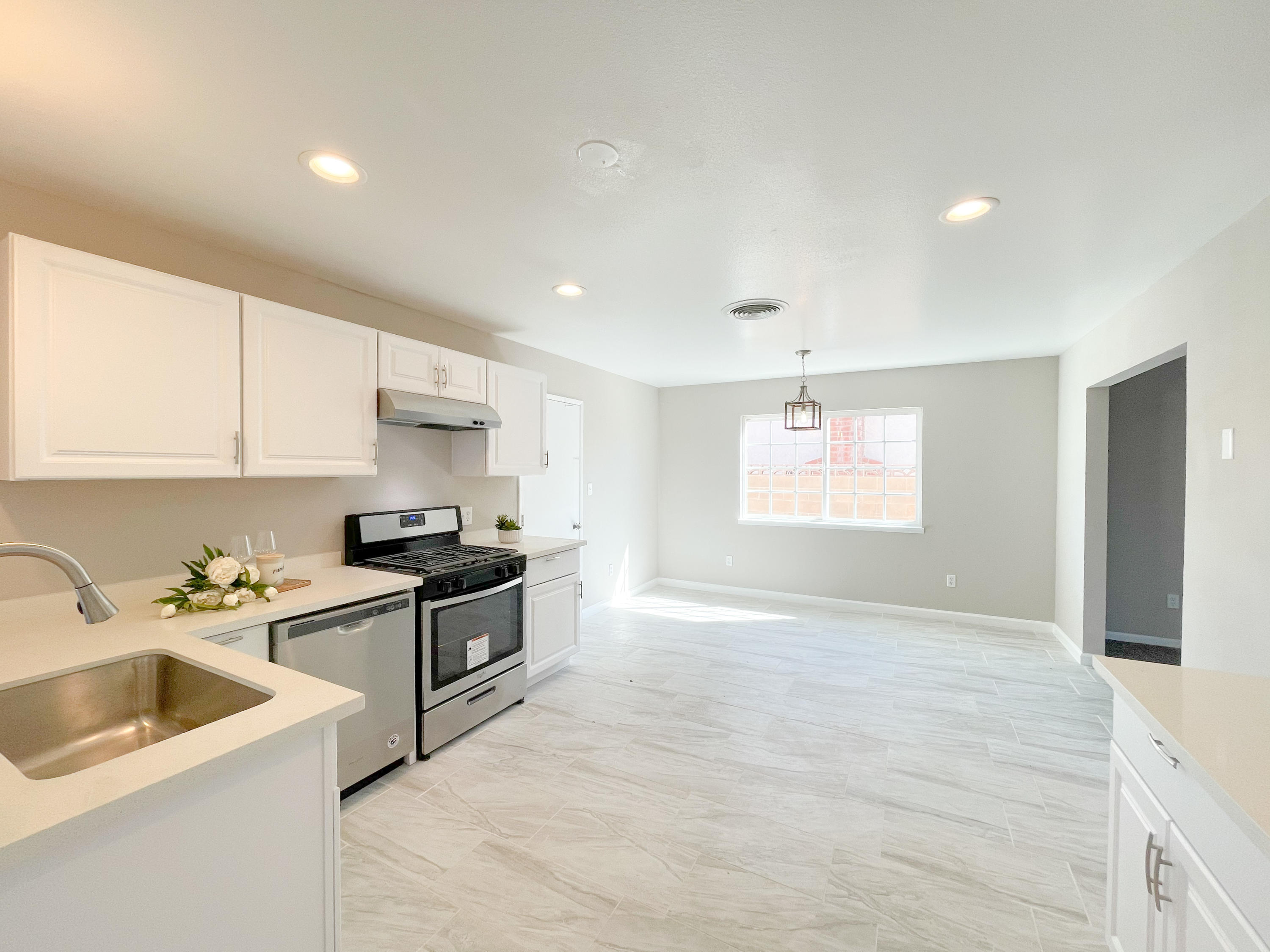 429 Peg Street Ridgecrest, CA 93555 - Photo 11 of 20 a kitchen that has a sink a stove and cabinets