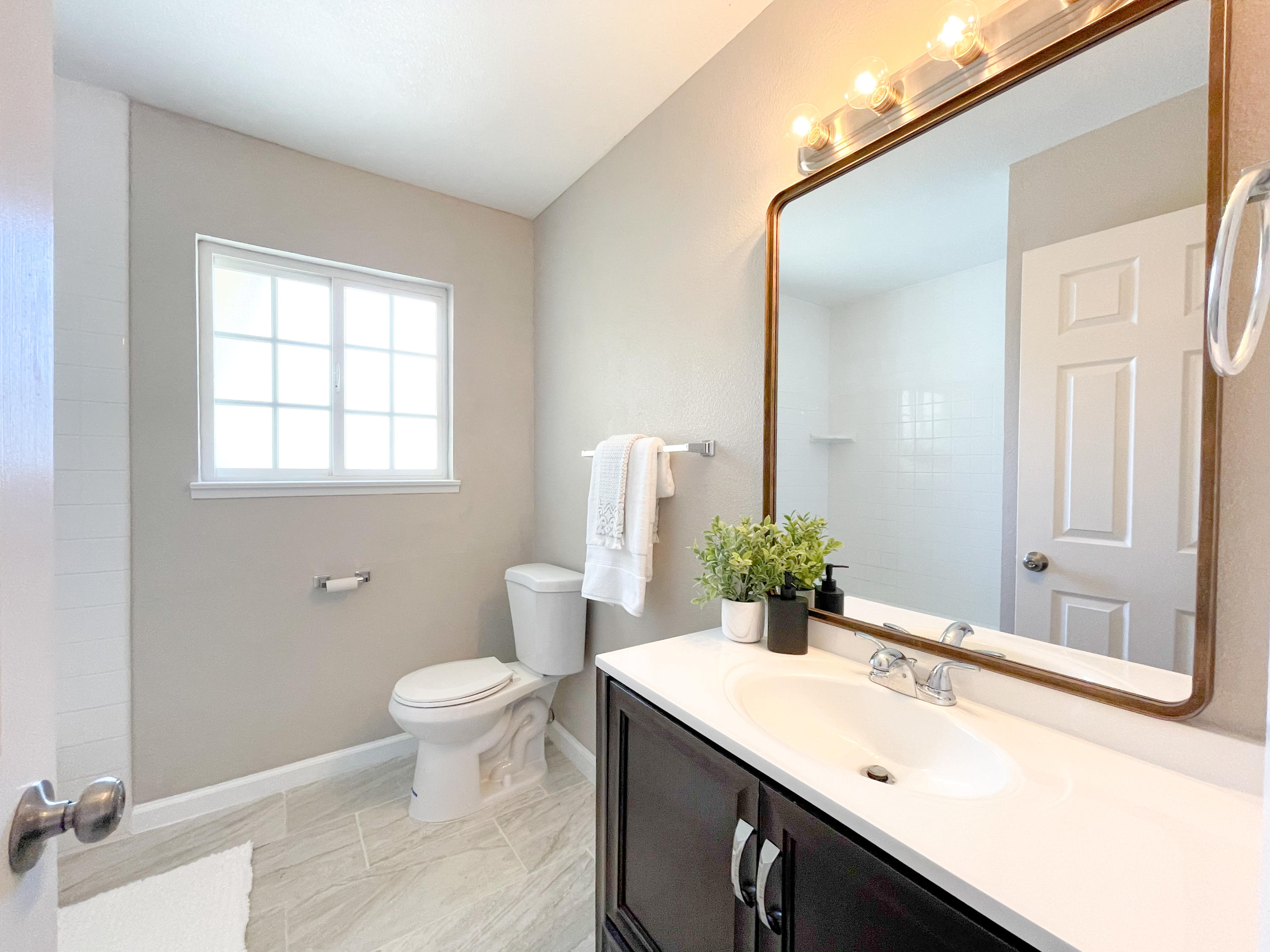 429 Peg Street Ridgecrest, CA 93555 - Photo 15 of 20 a bathroom with a sink and a mirror