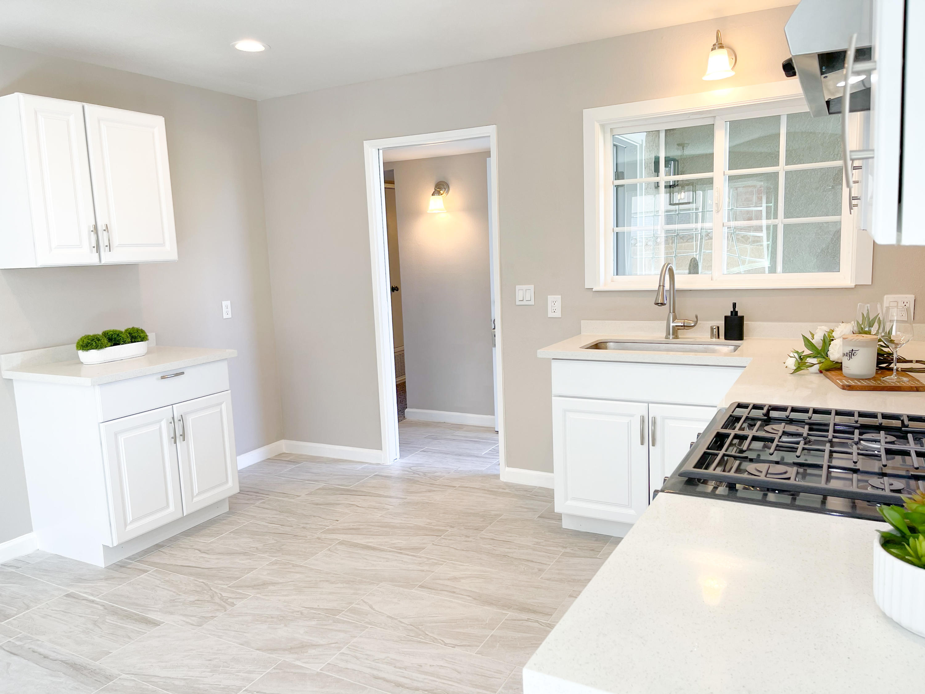 429 Peg Street Ridgecrest, CA 93555 - Photo 10 of 20 a kitchen with a sink stove and cabinets