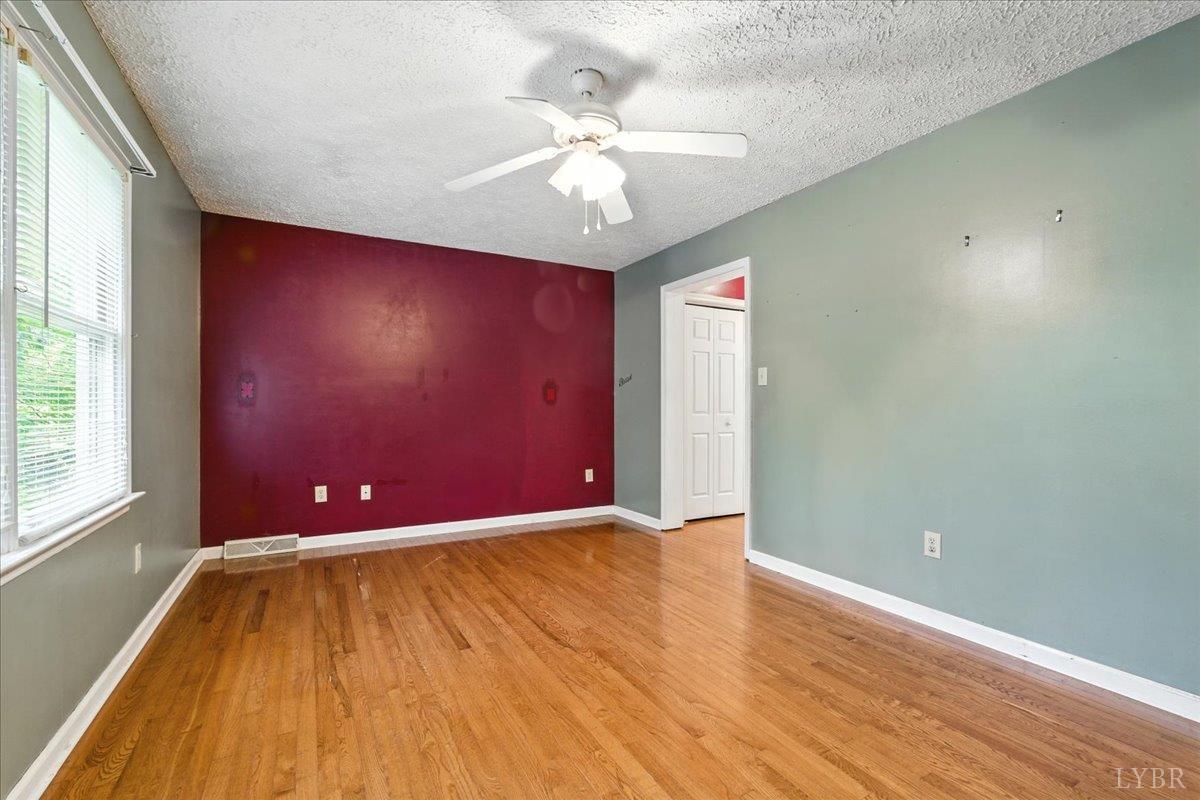 2926 Forbes Mill Road Bedford, VA 24523 - Photo 15 of 36 wooden floor in an empty room with a window