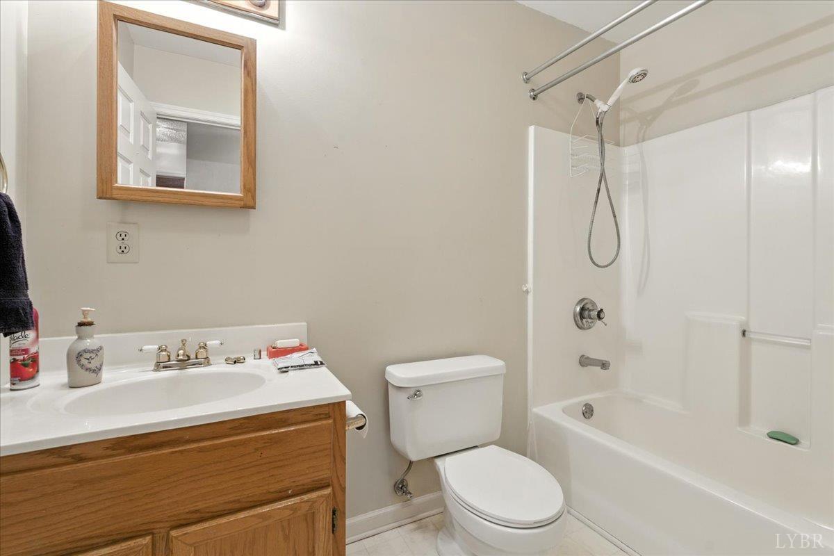 2926 Forbes Mill Road Bedford, VA 24523 - Photo 19 of 36 a bathroom with a sink toilet and shower
