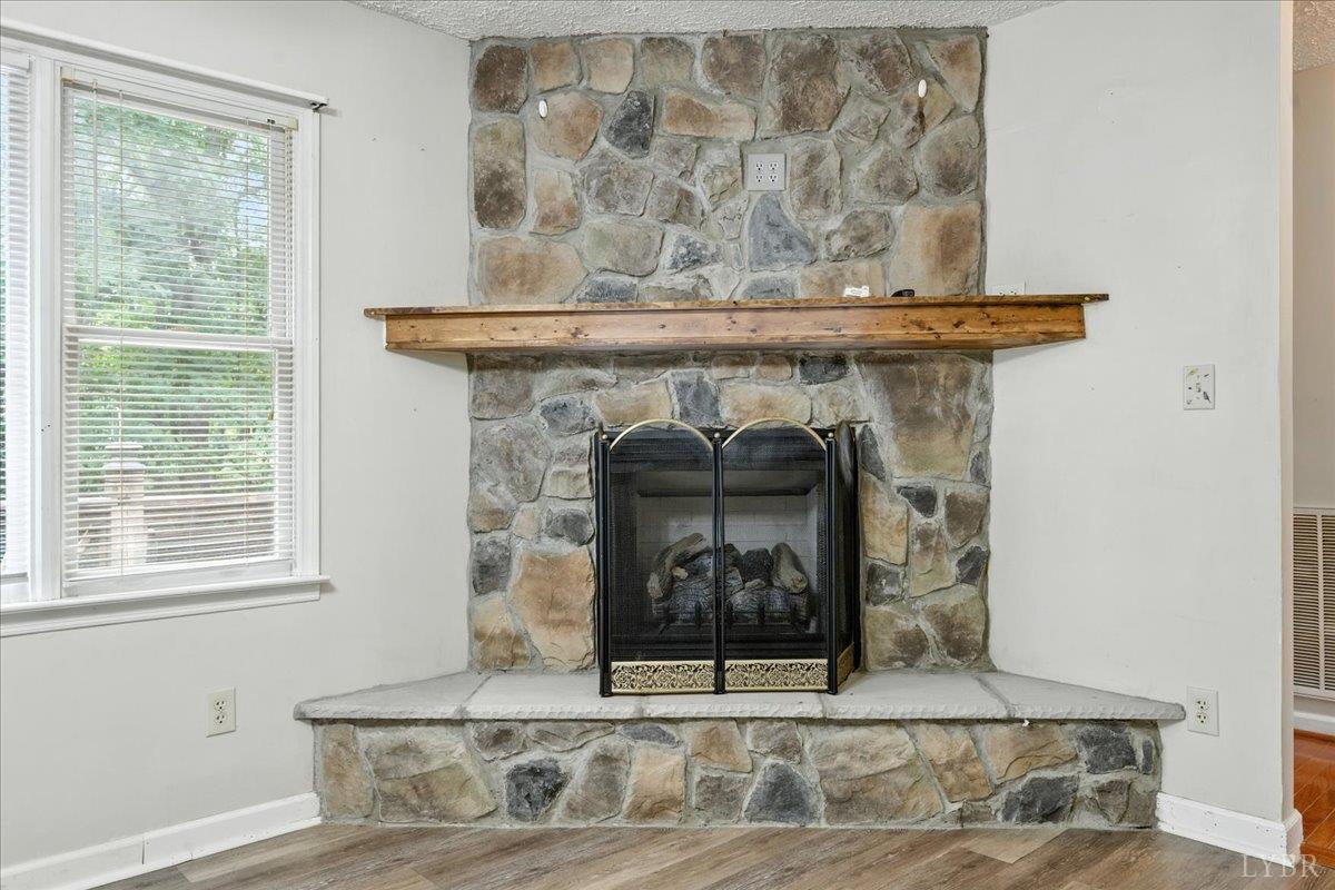 2926 Forbes Mill Road Bedford, VA 24523 - Photo 6 of 36 a view of a fireplace with a wooden floor