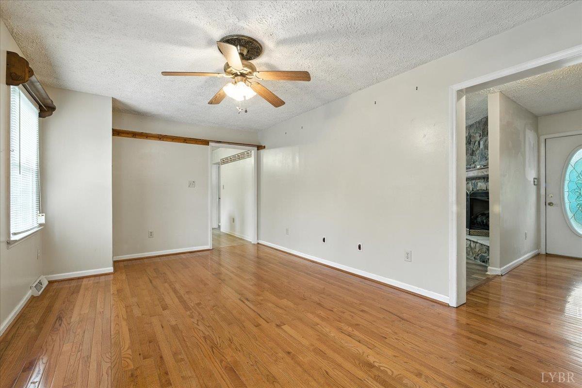 2926 Forbes Mill Road Bedford, VA 24523 - Photo 7 of 36 a view of an empty room with wooden floor