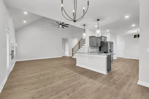 a view of kitchen with sink microwave and stove