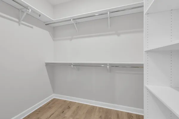 a view of an empty walk in closet