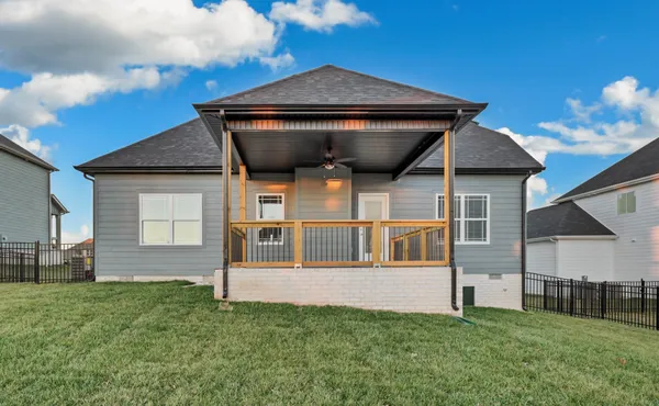 a view of house with backyard
