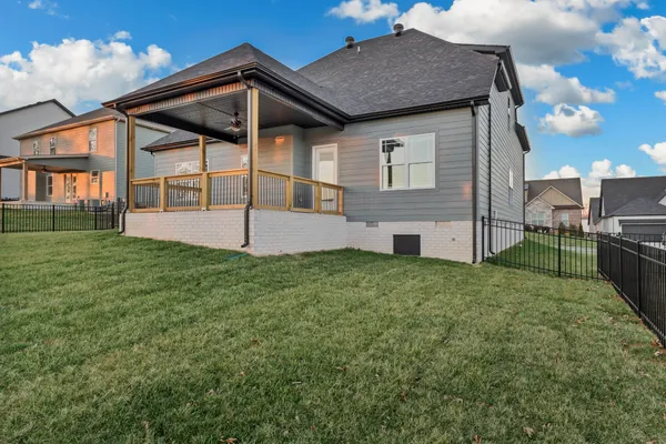 a view of a backyard of the house