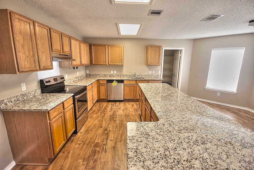 1913 Ruthie Run Cedar Park, TX 78613 - Photo 1 of 1 a kitchen with stainless steel appliances granite countertop a sink stove and refrigerator