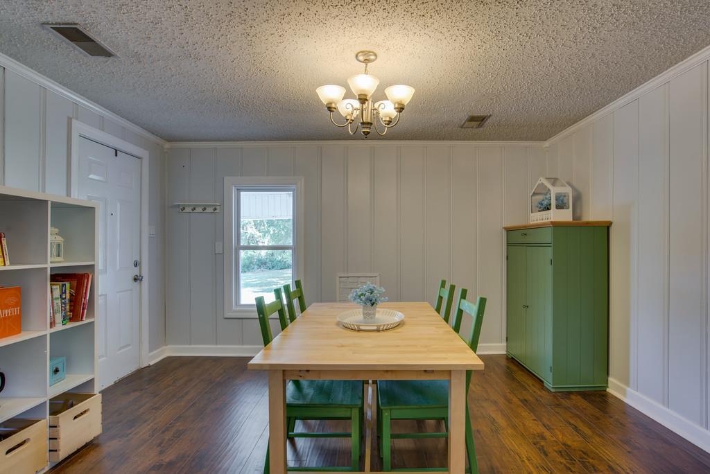 4467 Kedron Road Spring Hill, TN 37174 - Photo 5 of 14 a view of a dining room with furniture and wooden floor