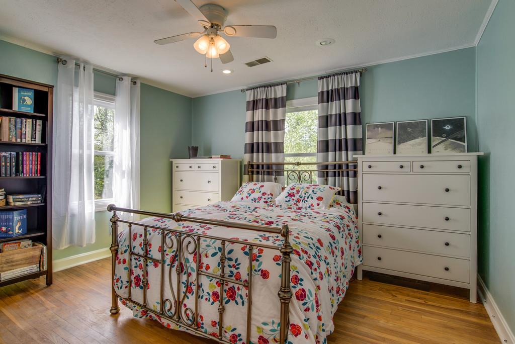 4467 Kedron Road Spring Hill, TN 37174 - Photo 6 of 14 a bedroom with a bed and a book shelf