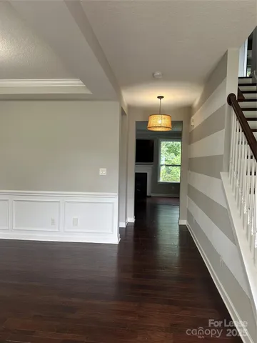 a view of an entryway with wooden floor