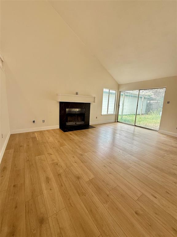 4243 Timberglen Road Dallas, TX 75287 - Photo 2 of 7 fireplace, fresh paint, new laminate floors, tall ceilings