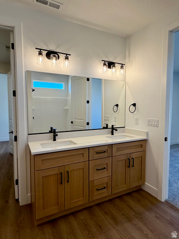 4956 North 925 East, Unit 87 Enoch, UT 84721 - Photo 11 of 19 Dual vanity with light wood-finish cabinetry, white countertops, and integrated rectangular sinks