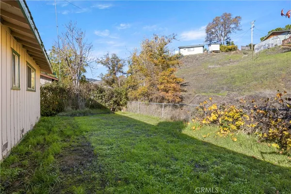 a view of a garden with a building