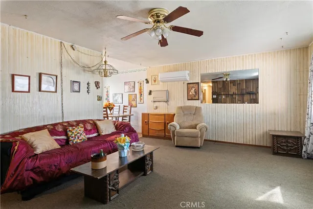 a bedroom with furniture and a chandelier
