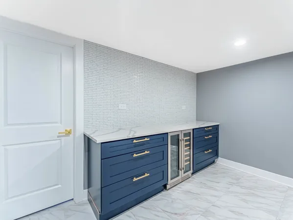 a room with a dresser and a night stand