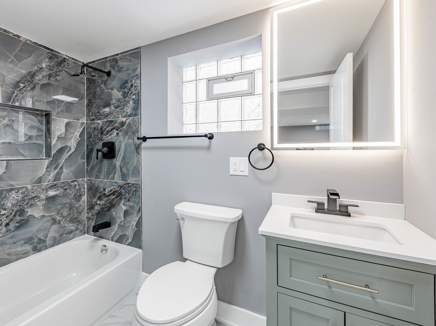 3053 West 77th Street Chicago, IL 60652 - Photo 19 of 23 a bathroom with a sink toilet and shower