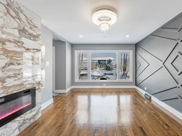 a view of a livingroom with wooden floor