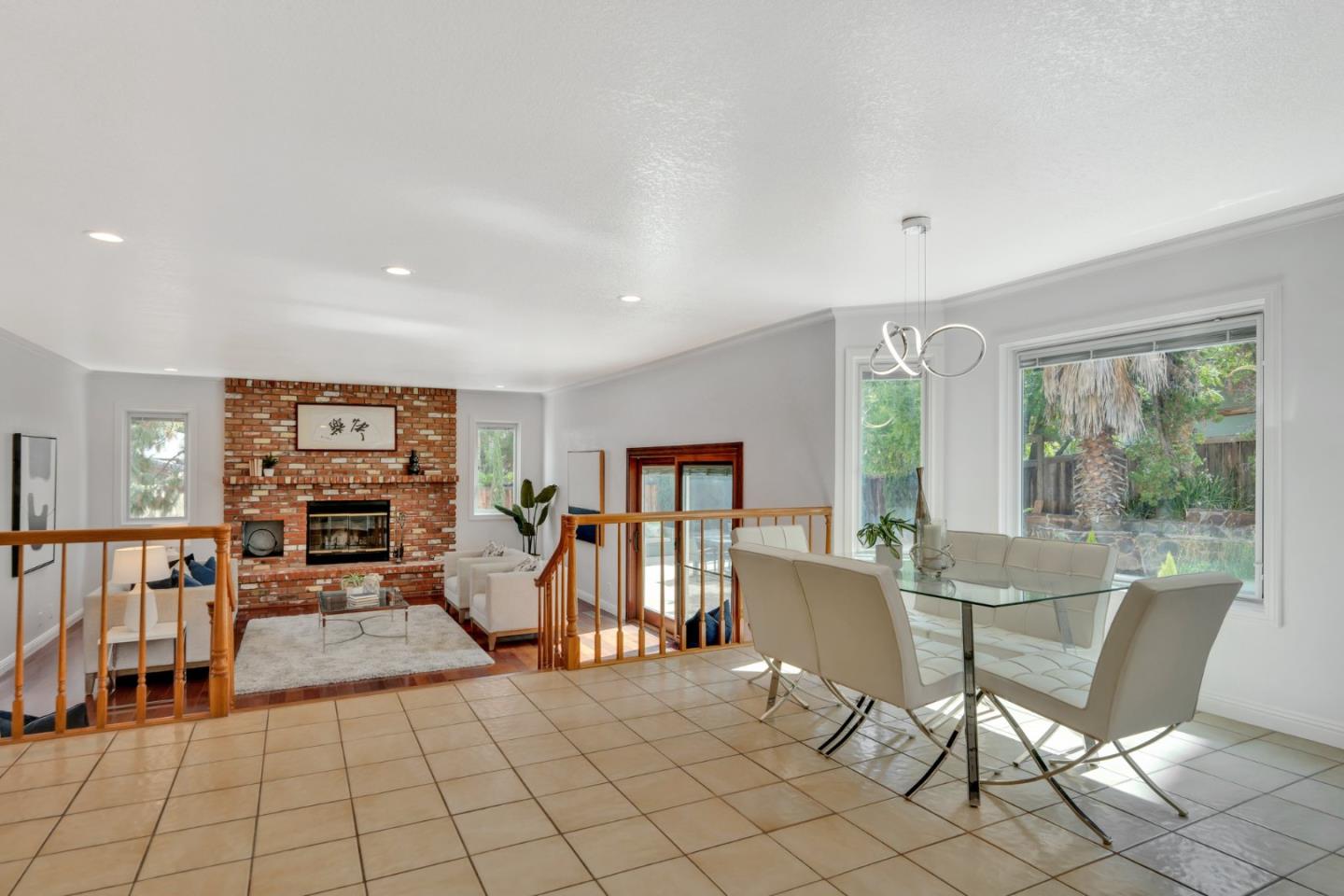 46950 Zapotec Drive Fremont, CA 94539 - Photo 14 of 40 a living room with furniture a fireplace and a large window