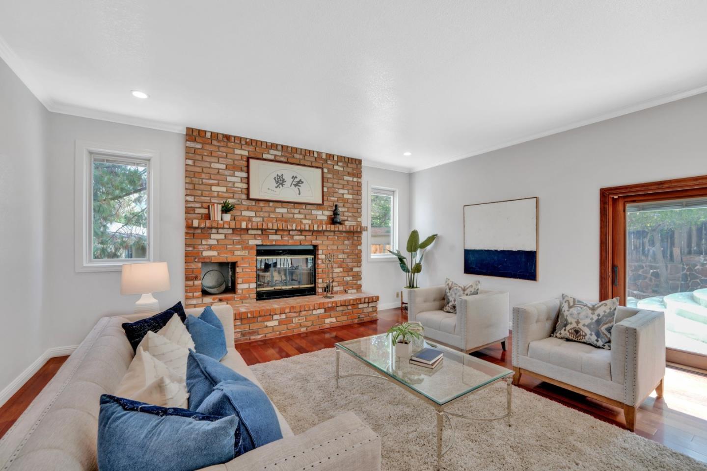 46950 Zapotec Drive Fremont, CA 94539 - Photo 16 of 40 a living room with furniture and a fireplace