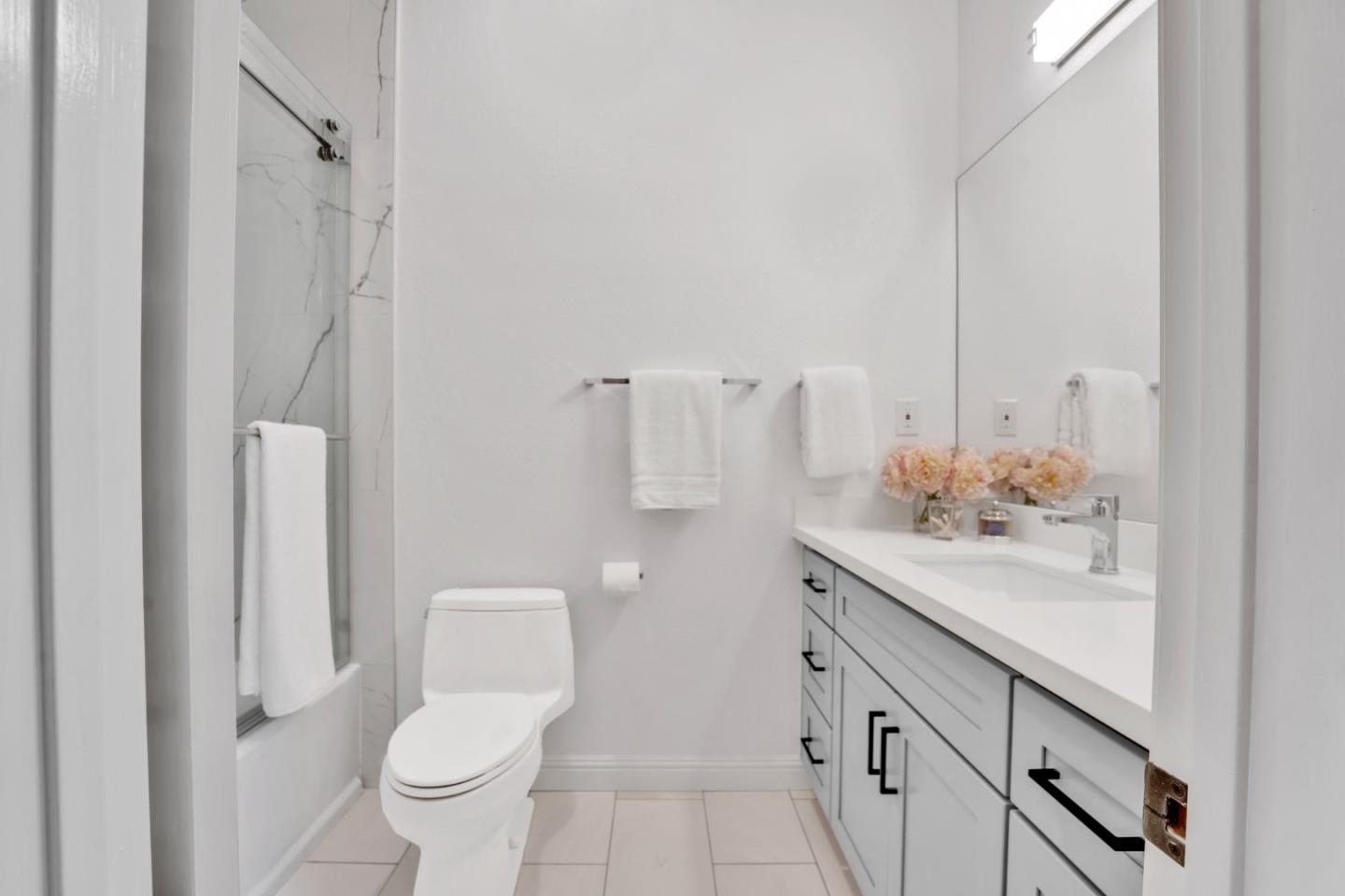 46950 Zapotec Drive Fremont, CA 94539 - Photo 17 of 40 a bathroom with a sink toilet and shower