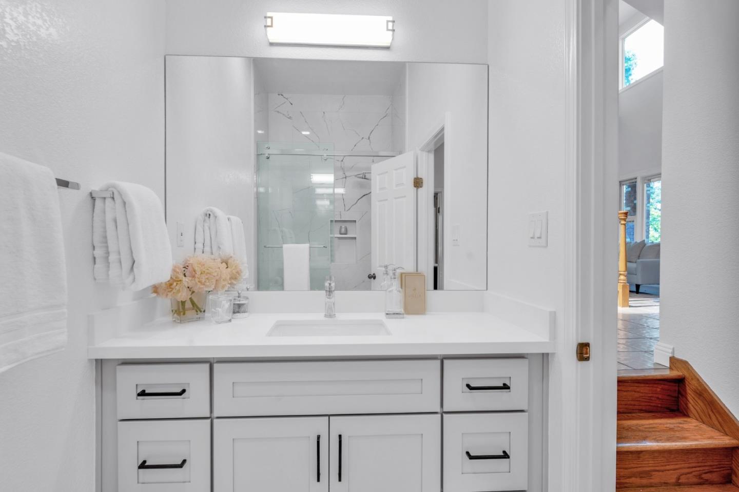 46950 Zapotec Drive Fremont, CA 94539 - Photo 18 of 40 a bathroom with a sink double vanity and a mirror