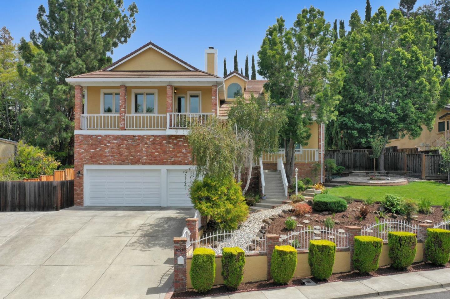 46950 Zapotec Drive Fremont, CA 94539 - Photo 2 of 40 a front view of a house with garden