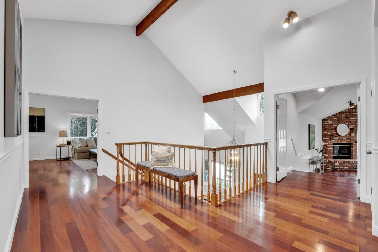 46950 Zapotec Drive Fremont, CA 94539 - Photo 22 of 40 a view of a hallway with wooden floor and a chandelier