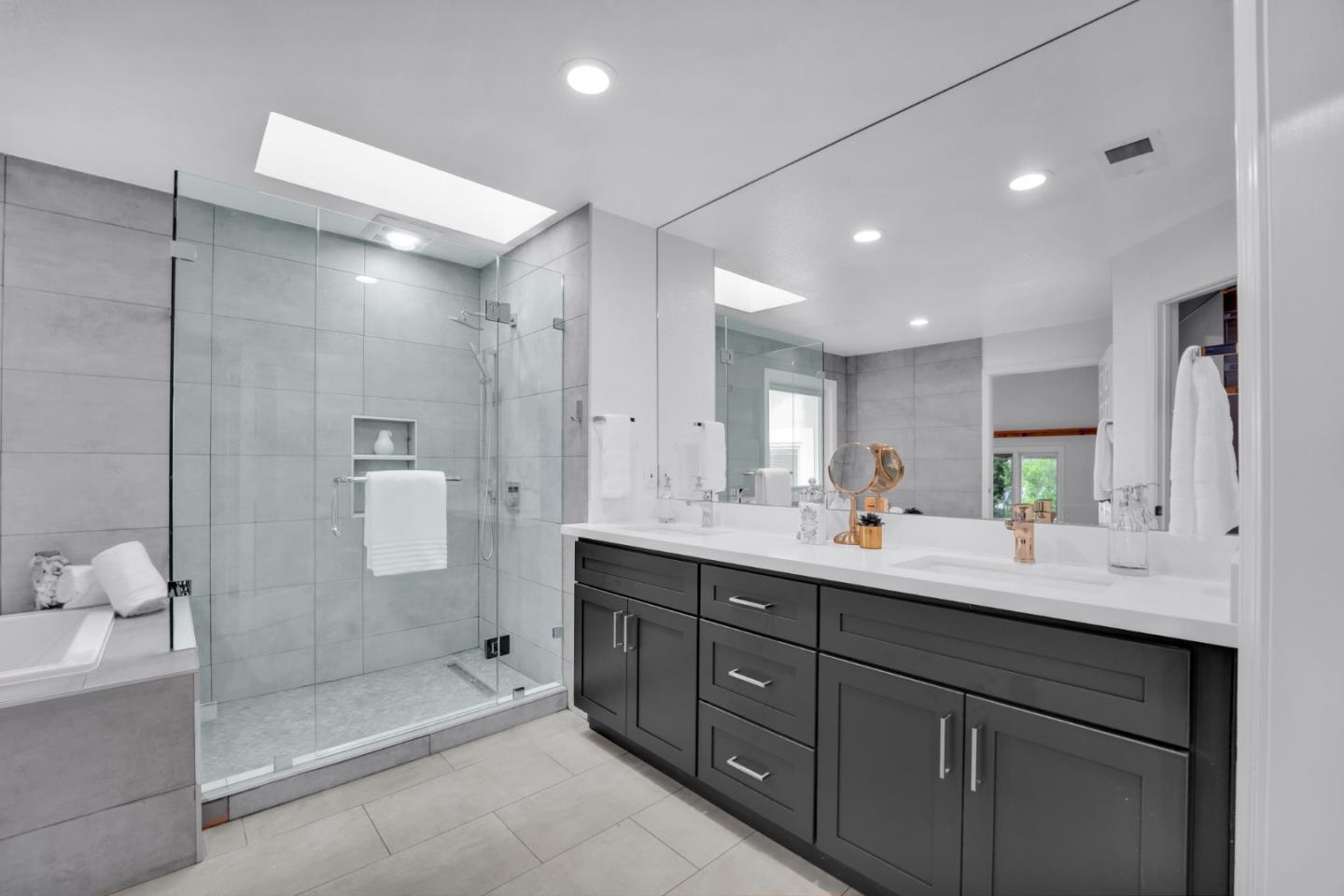 46950 Zapotec Drive Fremont, CA 94539 - Photo 27 of 40 a bathroom with a double vanity sink mirror and shower