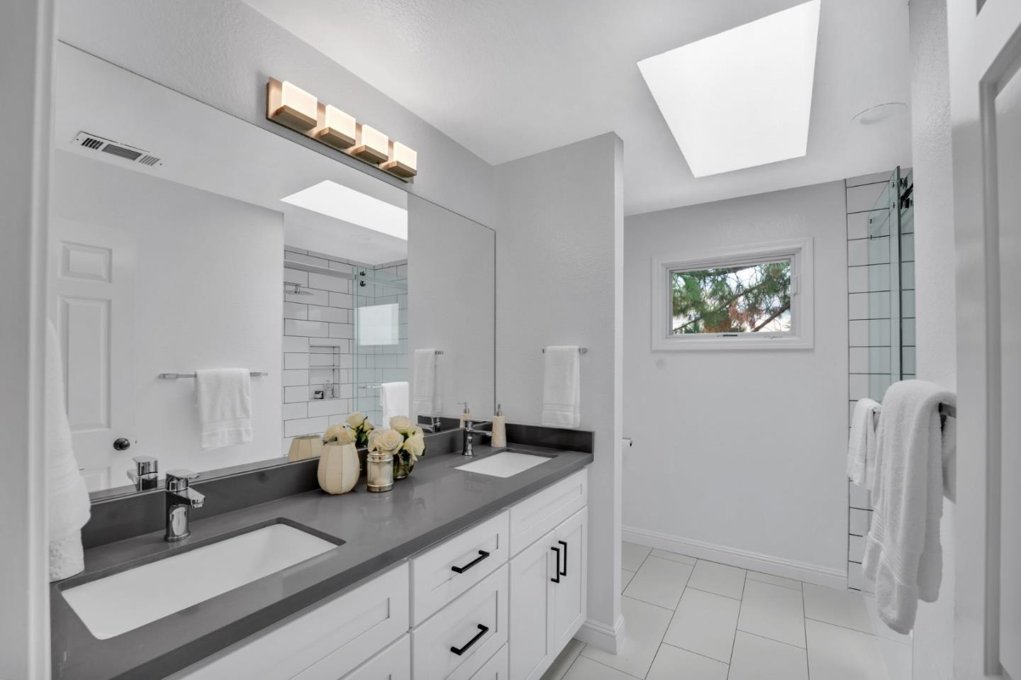 46950 Zapotec Drive Fremont, CA 94539 - Photo 30 of 40 a bathroom with sinks and mirror