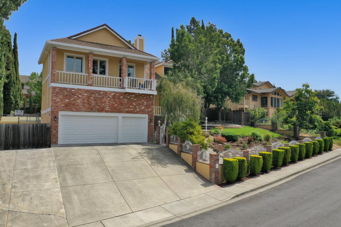 46950 Zapotec Drive Fremont, CA 94539 - Photo 3 of 40 a front view of a house with a garden