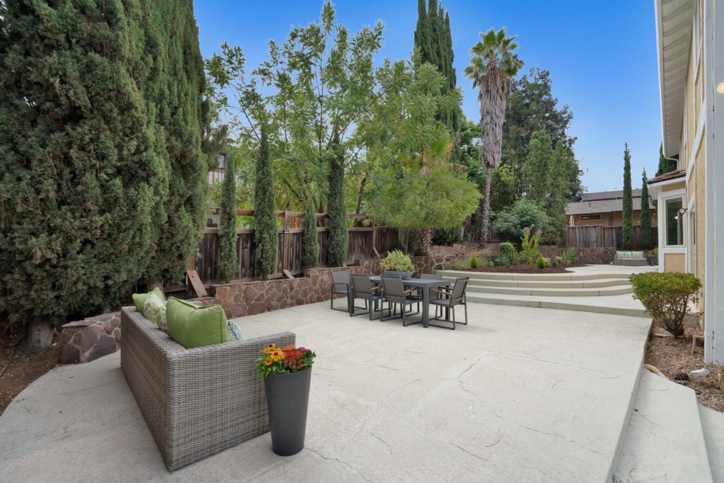 46950 Zapotec Drive Fremont, CA 94539 - Photo 34 of 40 a view of a patio with couches and a fire pit and a fire pit