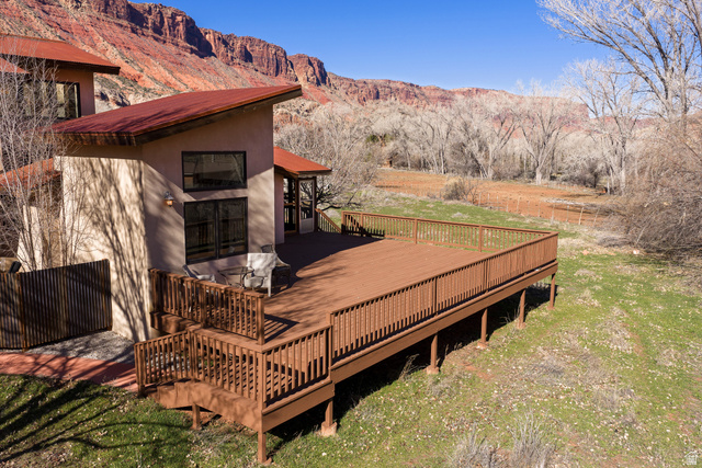 423 Amber Lane Moab, UT 84532 - Photo 4 of 63 Large wrap around deck with a view of the back yard.