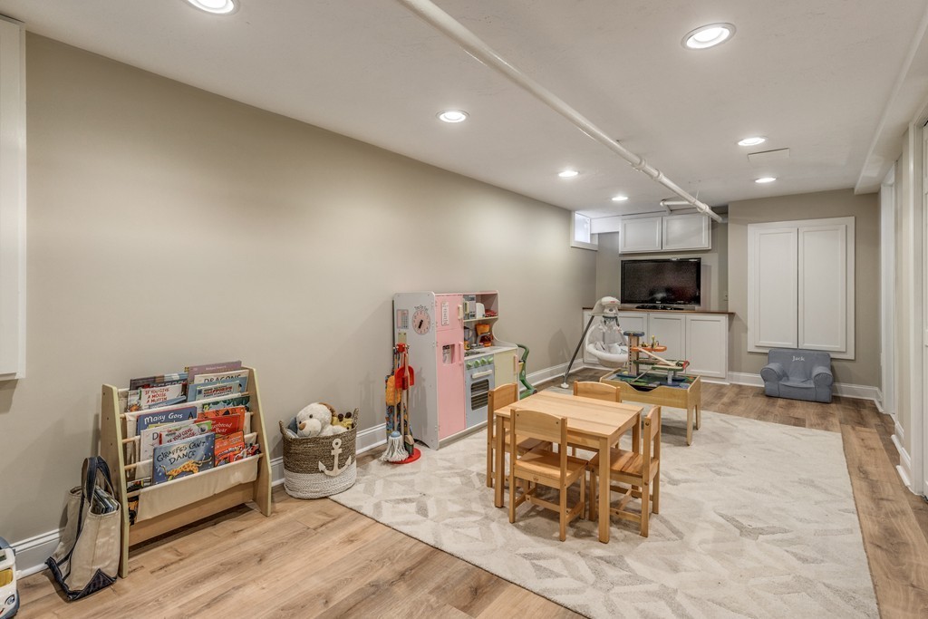 16 Marion Road Marblehead, MA 01945 - Photo 26 of 30 a room with furniture a flat screen tv and gym equipment