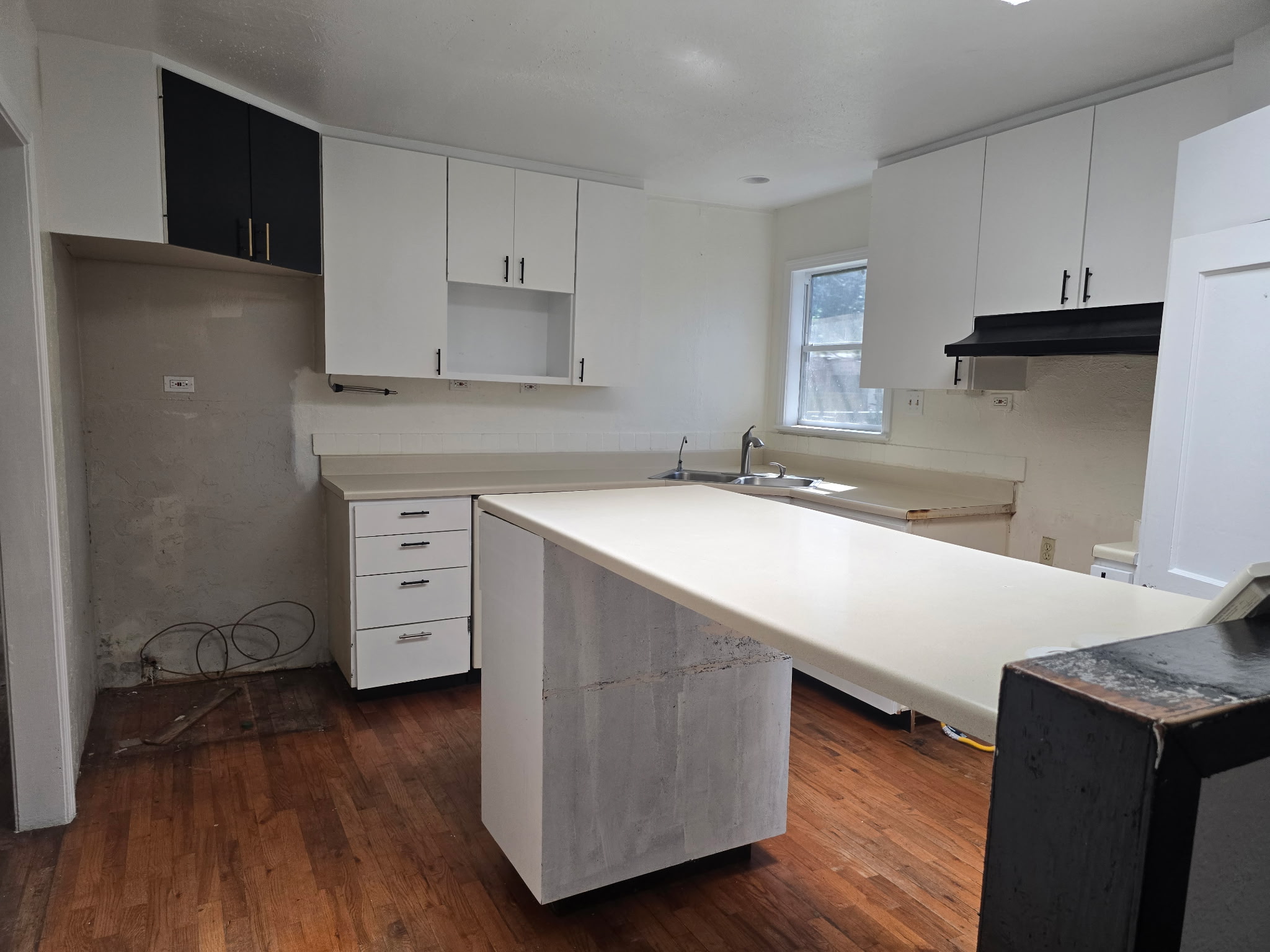 305 North 5th Street Thorndale, TX 76577 - Photo 13 of 20 a kitchen with stainless steel appliances a sink a stove a refrigerator and cabinets
