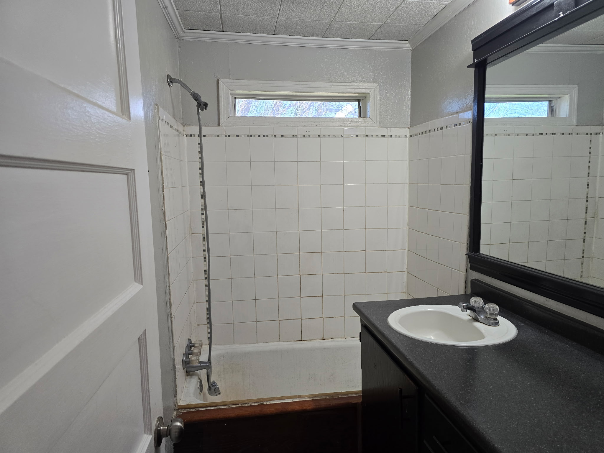 305 North 5th Street Thorndale, TX 76577 - Photo 16 of 20 a bathroom with a sink and a mirror