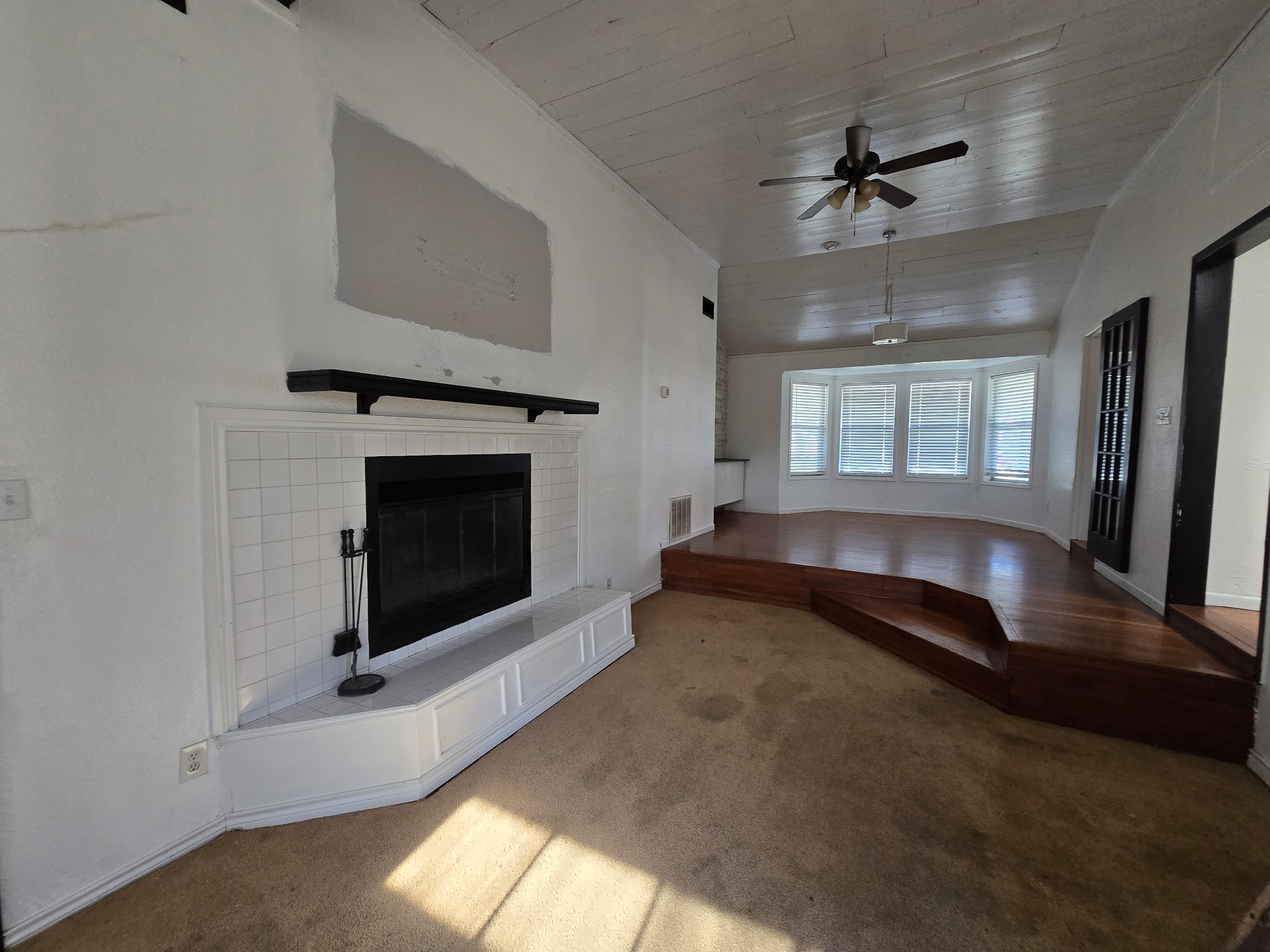 305 North 5th Street Thorndale, TX 76577 - Photo 9 of 20 a spacious bedroom with a bed and a fireplace