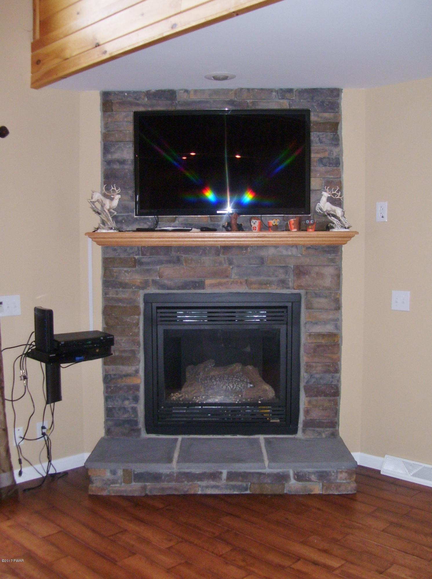103 Cold Spring Lane Greentown, PA 18426 - Photo 11 of 63 Great Room Fireplace