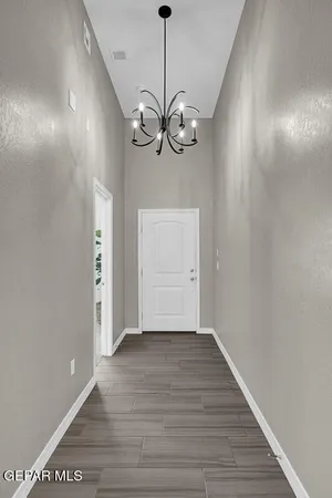 a view of an entryway with wooden floor