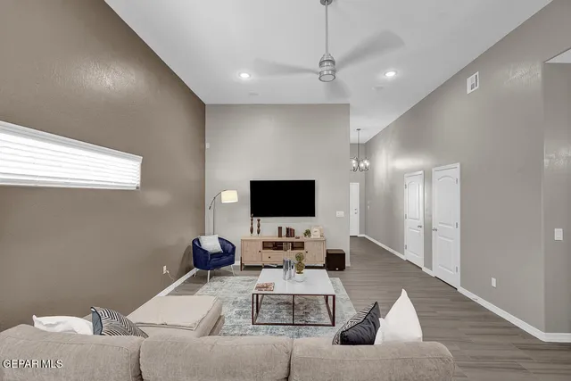 a living room with furniture and a flat screen tv