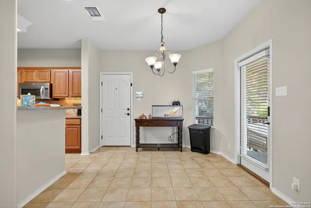 a view of a kitchen with a sink and dishwasher cabinet door
