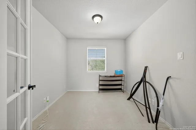 a view of room with air conditioner and windows