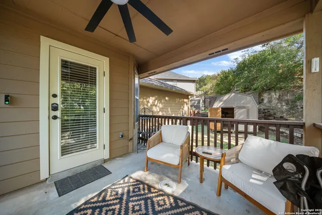 a balcony with furniture and wooden floor